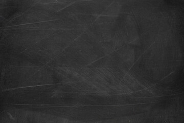 Naklejka premium Texture of chalk rubbed out on blackboard or chalkboard background. School education, dark wall backdrop or learning concept.