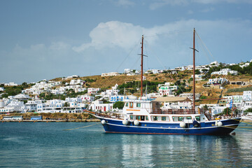 Fototapeta na wymiar Vessel schooner moored in port harbor of Chora town, Mykonos island, Greece