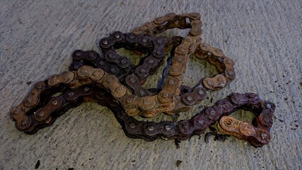 Chain of rusty motorcycle on the floor