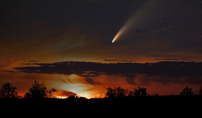 A composite of comet Neowise as it flies overhead in the summer sky. A composite of two photos...