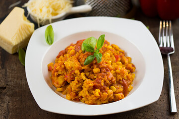 Rice and chicken breast cooked in tomato sauce.