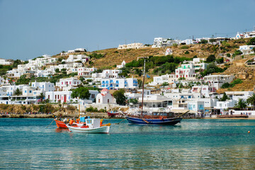 Fototapeta na wymiar Mykonos port with fishing boats and yachts and vessels. Mykonos island, Greece