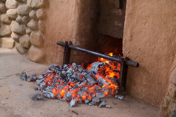 charcoal from burned pine firewood in a sauna oven.