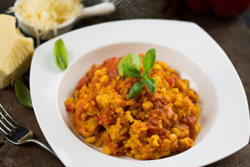 Rice and chicken breast cooked in tomato sauce.
