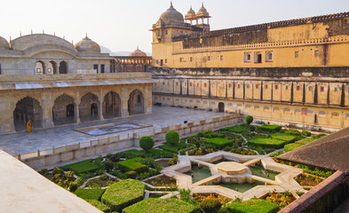 Beautiful courtyard garden inside Amber Fort and Palace in Jaipur in Rajasthan in India with...