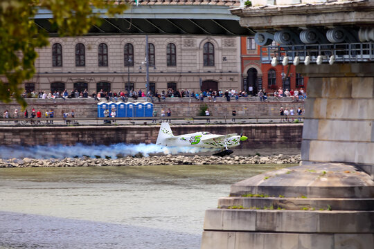 A Aerobatic Aircraft Zivko Edge 540 Flying Under The Chain Bridge As Part Of Red Bull Air Race