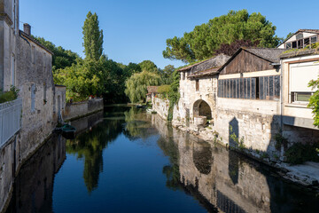 Fototapeta na wymiar Canal in the city of Pons, France. Near Cognac.