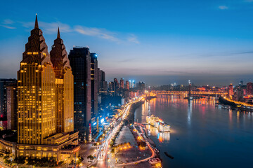 Fototapeta na wymiar Golden tall buildings along the Yangtze River in Chongqing, China