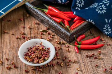 Peppercorns and chili placed on the wooden table

