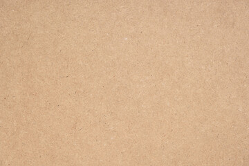 Texture of brown craft or kraft paper background, cardboard sheet, recycle paper, copy space for text.