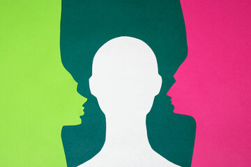 The paper profiles and paper full face were cut out from green, pink and white paper. The photo of paper art was shot flat lay for your craft design.