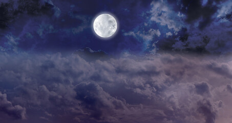 Obraz na płótnie Canvas High Full Moon Night Time Cloudscape - dark blue night sky with a bright full moon centrally placed above the clouds with plenty of copy space for messages 