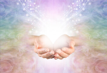 Healing is a magical experience  - female hands with with white light and a flow of sparkles...
