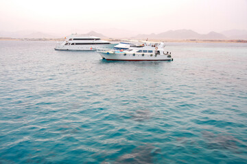 Tourist yachts in egypt. View of the Red Sea and the coast.