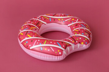 Inflatable ring on color background