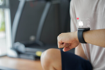 close up young man using smart watch to monitoring about healthcare tracker with virtual display to...