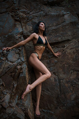 Fototapeta na wymiar Hight fashion portrait of young tan fit sexy model posing. Sensual. Sport body. 
