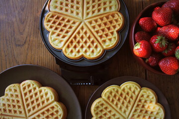 Chef finish making heart shape pancake with pan in kitchen
