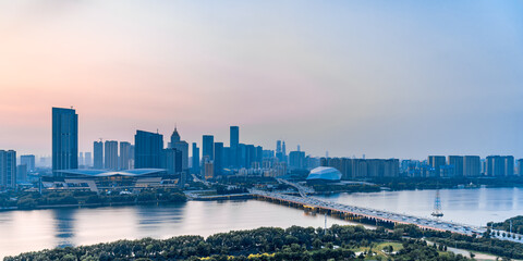 Dusk scenery of Shengjing Theater and urban buildings along the Hun River in Shenyang, Liaoning, China