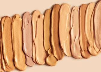 Collection of make up foundation drop smudge texture beige isolated background