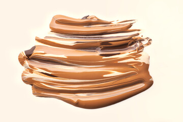 Collection of make up foundation drop smudge texture beige isolated background
