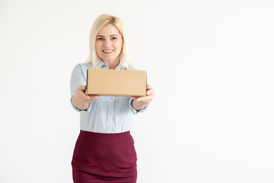 picture of attractive businesswoman delivering cardboard box