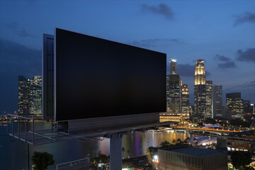 Blank black road billboard with Singapore cityscape background at night time. Street advertising poster, mock up, 3D rendering. Side view. The concept of marketing communication to sell idea.