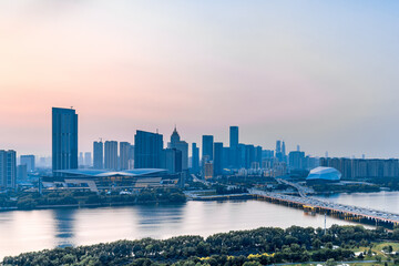 Dusk scenery of Shengjing Theater and urban buildings along the Hun River in Shenyang, Liaoning, China