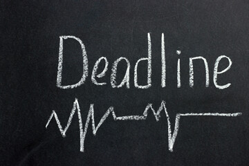 
The inscription on a dark blackboard deadline with a curve line. A common phrase among freelancers