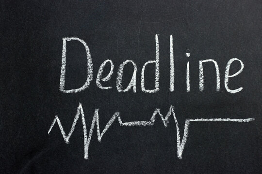 
The inscription on a dark blackboard deadline with a curve line. A common phrase among freelancers