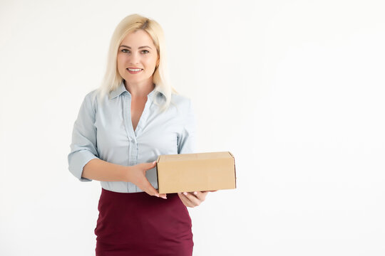 picture of attractive businesswoman delivering cardboard box