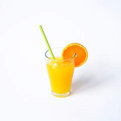 Orange juice in a glass with straw isolated on white background