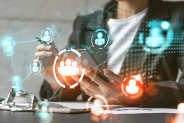 Multi exposure of woman using phone background and people icon network hologram. Concept of social media.