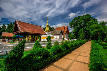 Background of an important tourist attraction in Khon Kaen, where tourists come to see the beauty always (Phra That Kham Kaen) is an old pagoda and has a beautiful golden yellow color, in Thailand