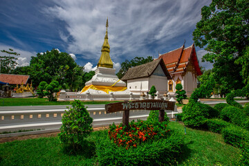 Background of an important tourist attraction in Khon Kaen, where tourists come to see the beauty always (Phra That Kham Kaen) is an old pagoda and has a beautiful golden yellow color, in Thailand