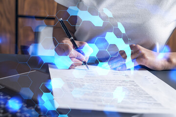 Multi exposure of woman signing a contract and high tech project background. Technology hologram....
