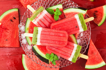 Homemade watermelon popsicles on a plate. Summer food concept.