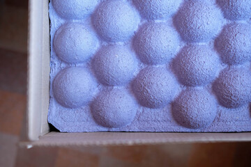 Purple packaging for the safety of the parcel. Unusual paper spacer for fixing goods