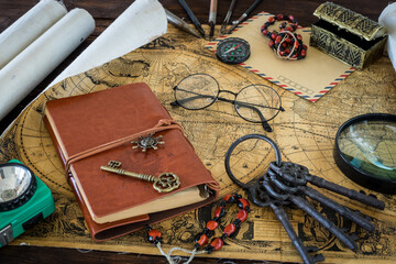 Old map and notebook, compass, Travel equipment for the treasure hunt