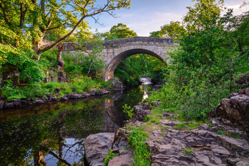 Fototapeta na wymiar River Wear below Stanhope Road Bridge, Stanhope is a small market town in County Durham situated on the upper reaches of the River Wear in Weardale