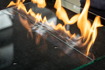 Glazier cuts safety glass, VSG (Very Safe Glass) The fire burns through the foil connecting the...
