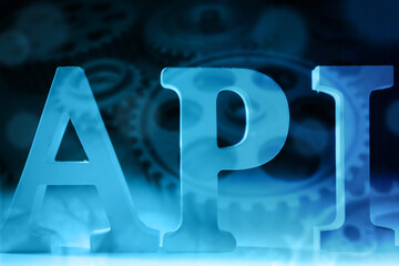 API logo. Inscription API next to the gears. Programming. Application programming interface....