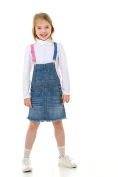 Little girl in a short denim dress.