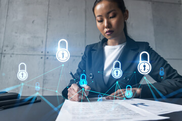 A woman signs contract and data security theme hologram. Double exposure.