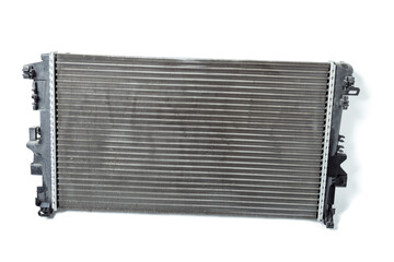Fototapeta premium The cooling radiator is a metal heat exchanger inside filled with antifreeze. Repair in the workshop. Parts Catalog.