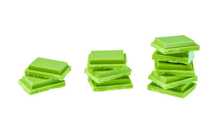 chocolate with matcha tea pieces tower isolated on white background. Cubes of green chocolate tower isolated on a white background.