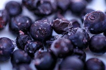 Frozen blueberry fruits, close up, top view, full frame, fruit background.