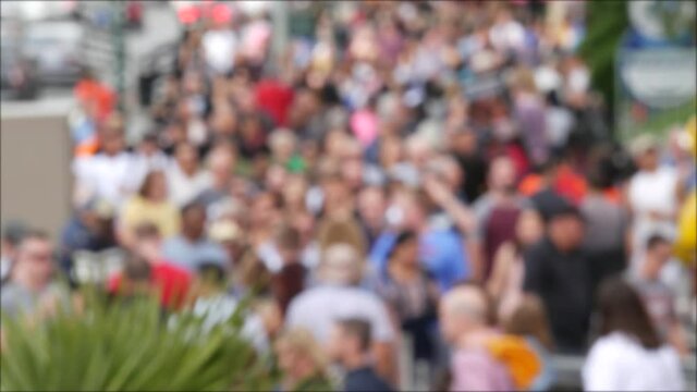 Defocused crowd of people, road intersection crosswalk on The Strip of Las Vegas, USA. Anonymous blurred pedestrians on walkway in crowded urban downtown. Unrecognizable american citizens in sin city.