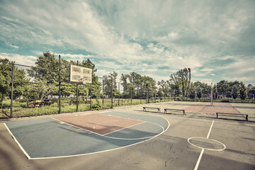 Retro toned picture of an empty basketball court in New York, USA.