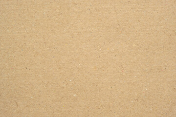Texture of brown craft or kraft paper background, cardboard sheet, recycle paper, copy space for text.